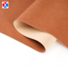 Brown textured PVC upholstery leather showing the surface and soft backing