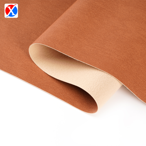 Brown textured PVC upholstery leather showing the surface and soft backing