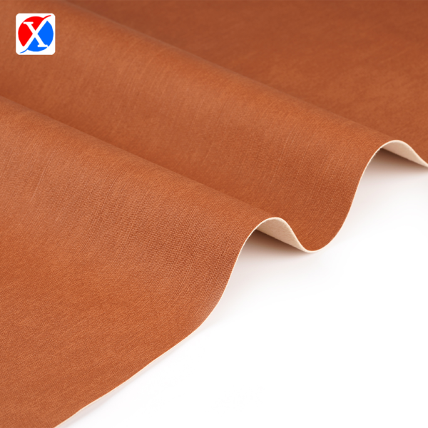 Brown textured PVC upholstery leather showing the surface and soft backing