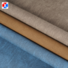 Brown textured PVC upholstery leather showing the surface and soft backing