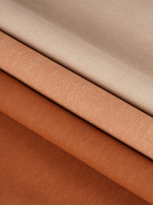 Brown textured PVC upholstery leather showing the surface and soft backing
